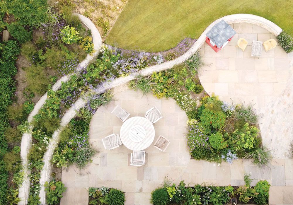 Landscape-Design-Lines-Intertwine-in-a-Way-That-Is-Difficult-To-Describe-Leading-Us-Out-And-Expanding-Loosely-In-One-Direction-And-Also-Surrounding-Us-Creating-A-Sense-Of-Being-Inside